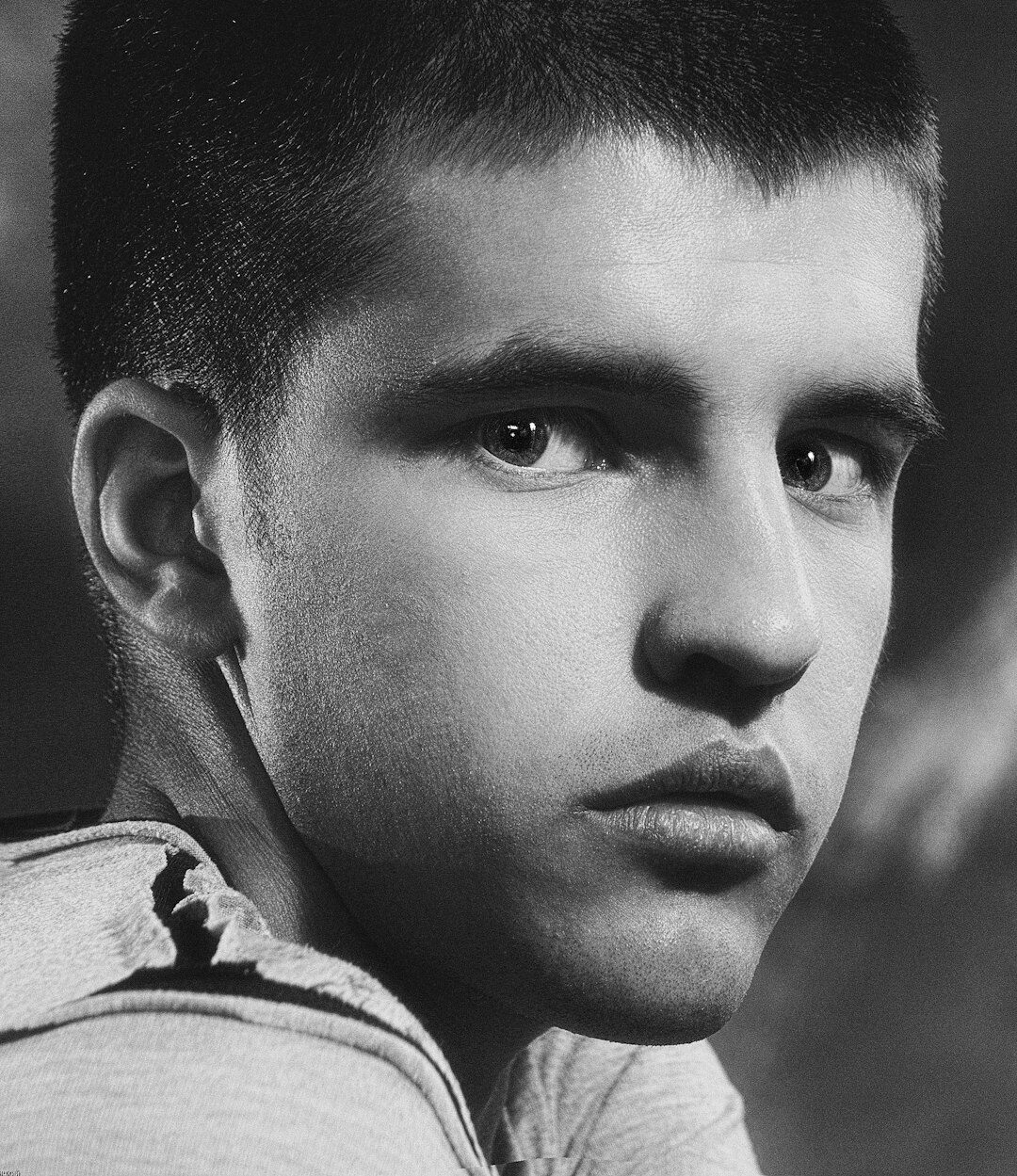 Studio portrait of a young man with short hair