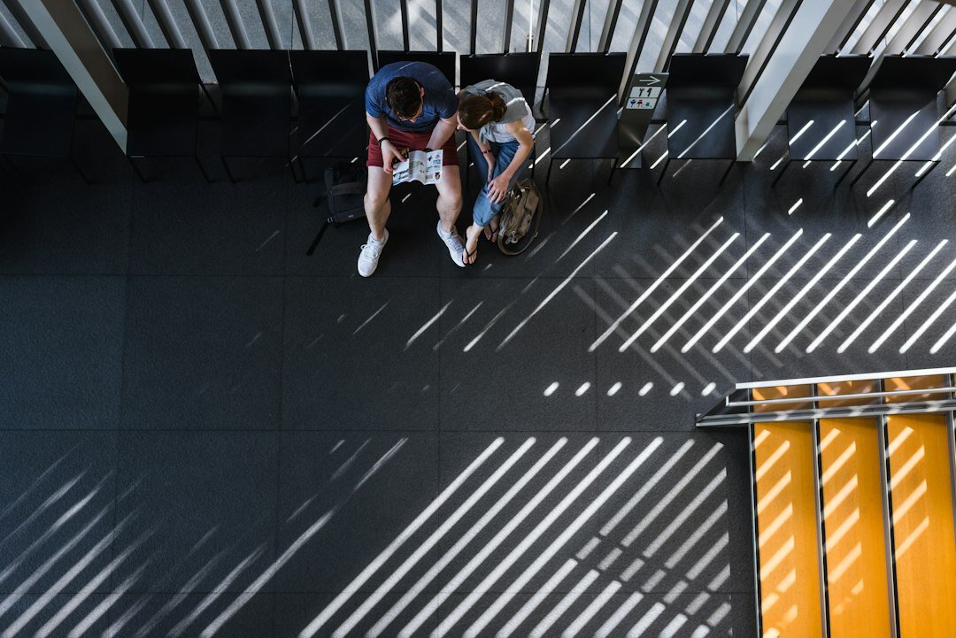 Two colleagues collaborating on a laptop during a work session